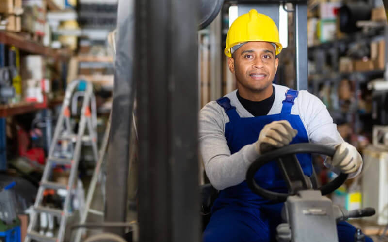 Man operating forklift