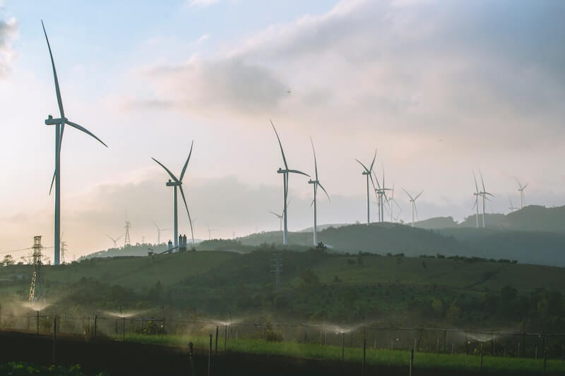 Windmill symbolizing sustainable energy, aligning with the article's focus on integrating sustainable practices into workforce strategies for a more responsible future.