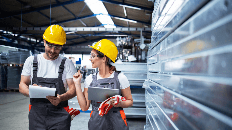 Manufacturing workers practicing workplace safety